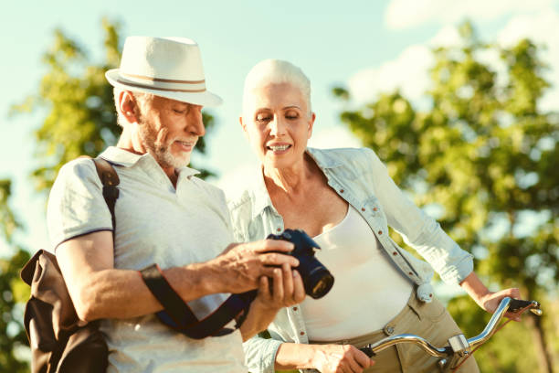istock Positive aged man showing photos 936908044