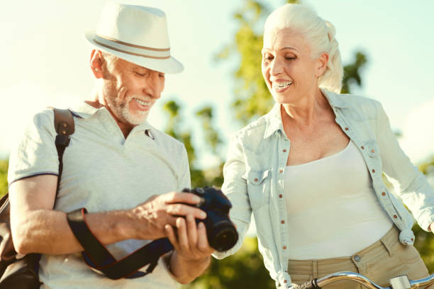 istock Cheerful senior man looking at the photos 936908052