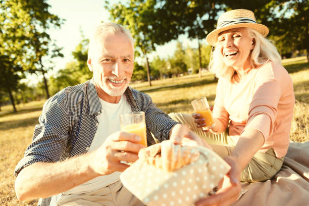 istock Joyful friendly man offering you a croissant 936911114