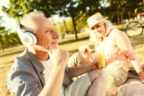 istock Positive aged man wearing headphones 936911172