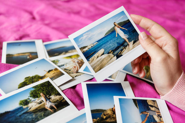 istock Browsing vacation photographs at home 936911550