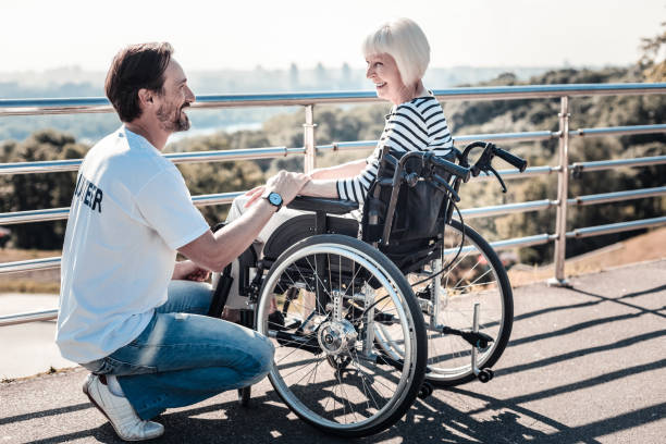 istock Cheerful positive man holding a womans hand 936911896