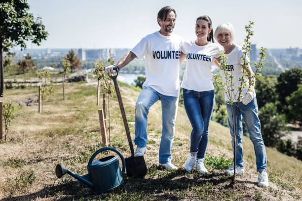 istock Joyful happy volunteers standing together 936915578