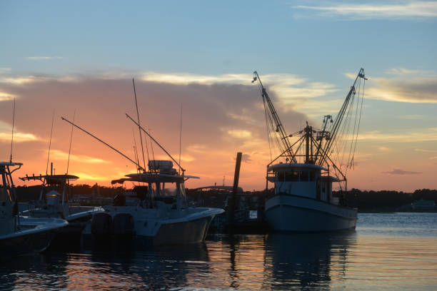 istock Fishing Boats at Dock - Sunset by Water 936920832
