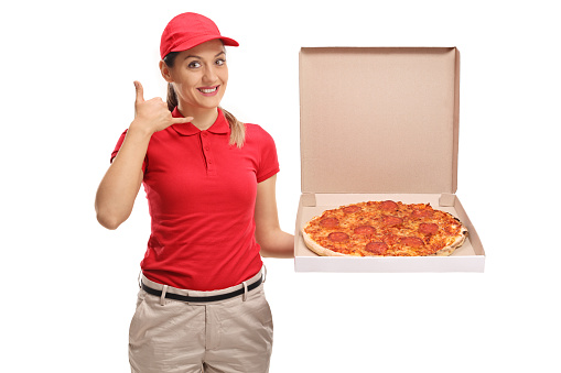 Pizza delivery girl making a call me gesture isolated on white background