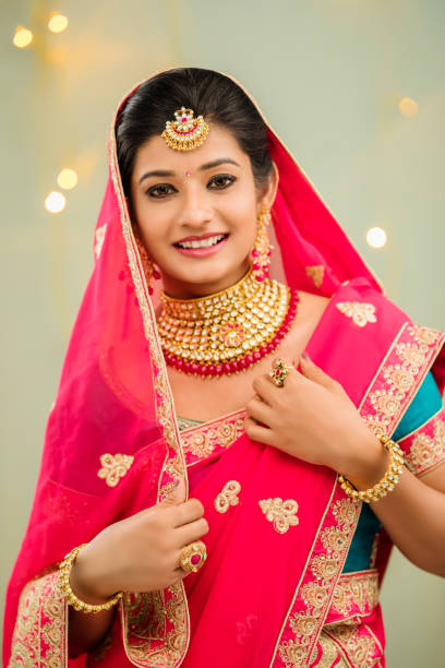 istock Beautiful smiling Indian bride with jewelry 936921424