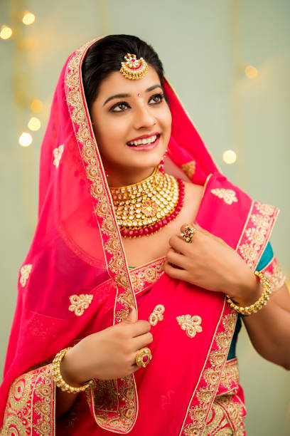istock Beautiful smiling Indian bride with jewelry 936921428