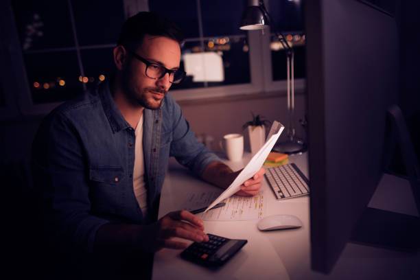 istock Young man running small business from home office 936924374