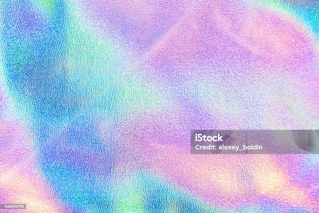Holographic real texture in blue pink green colors with scratches and irregularities Holographic real texture in blue pink green colors with scratches and irregularities. Holographic color wrinkled foil. Holographic rainbow foil abstract background. Textured Stock Photo
