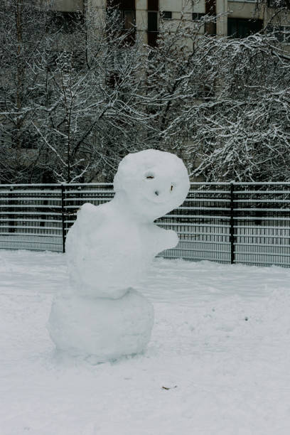 istock Snowmen on the Playground in the Winter yard, 936925420