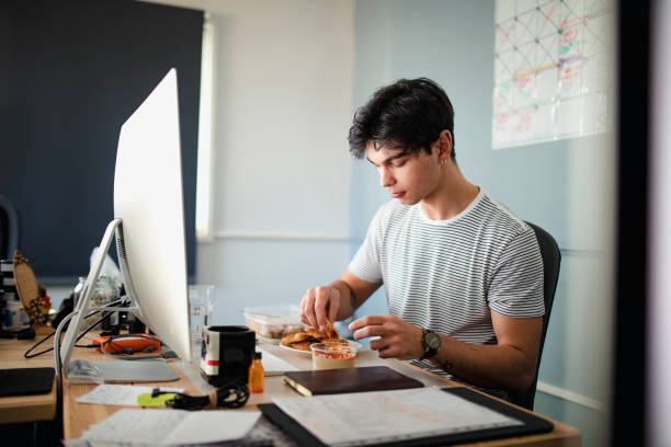 Eating Lunch at his Desk