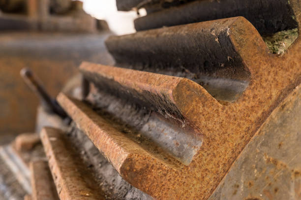 istock Abandoned water mill gear. Rusty iron wheel with teeth natural background 936928536
