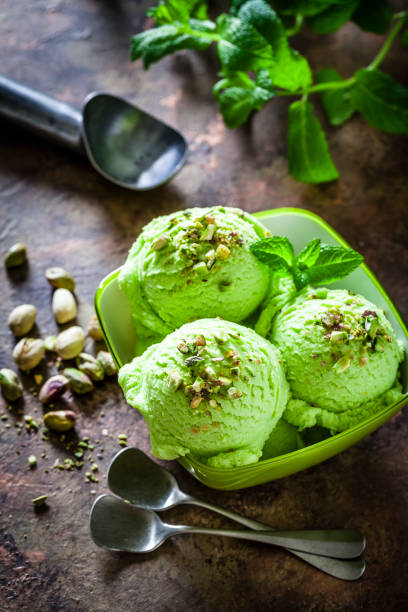istock Pistachio ice cream in a green bowl 936933478