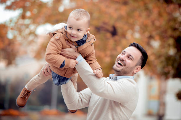 istock Happy joyful father having fun outdoors with child 936952434
