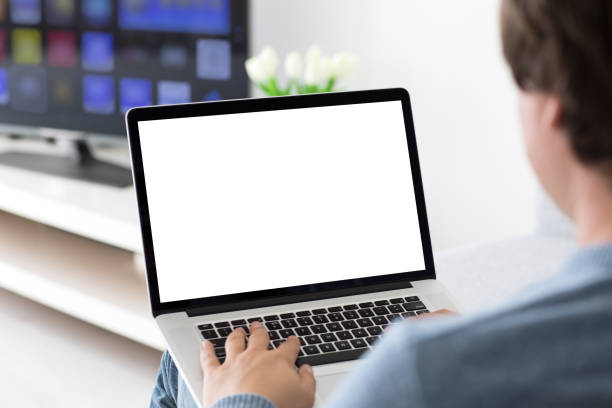 istock man typing on laptop keyboard with isolated screen in room 936958082