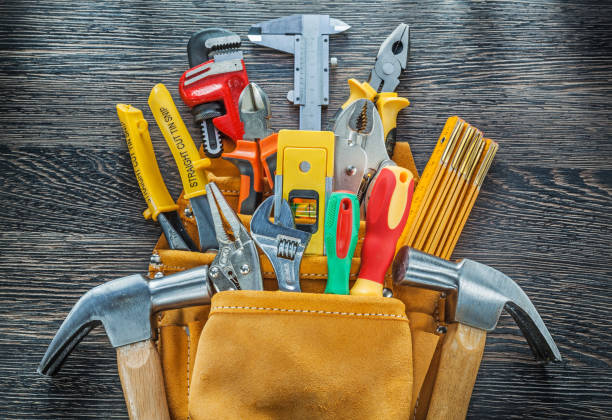 istock Leather toolbelt building tools on wooden board directly above 936961556