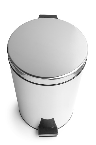Stainless steel trash can with pedal on white background