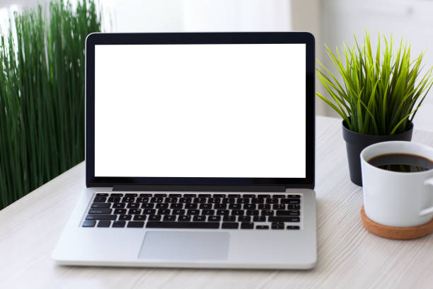 istock Computer laptop with isolated screen on desk in home room 936963526