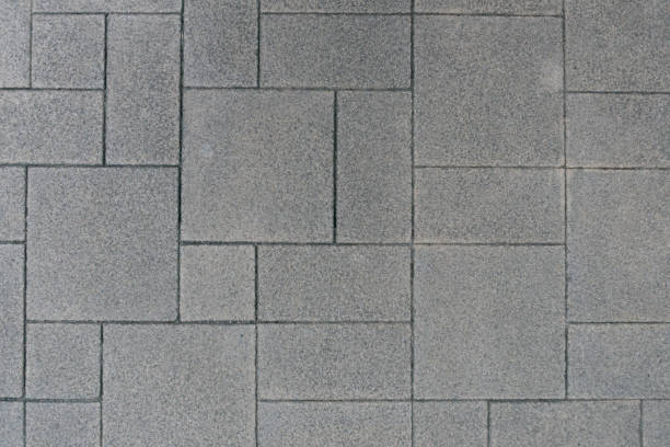 istock Gray brick pavement perspective, background photo texture 936966370