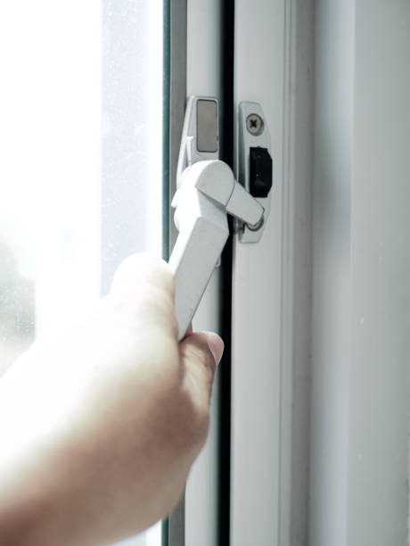 istock holding glass window latch lever 936971860