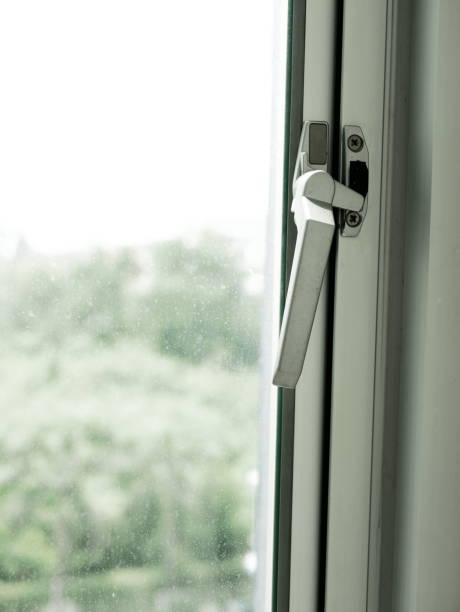 istock holding glass window latch lever 936972376