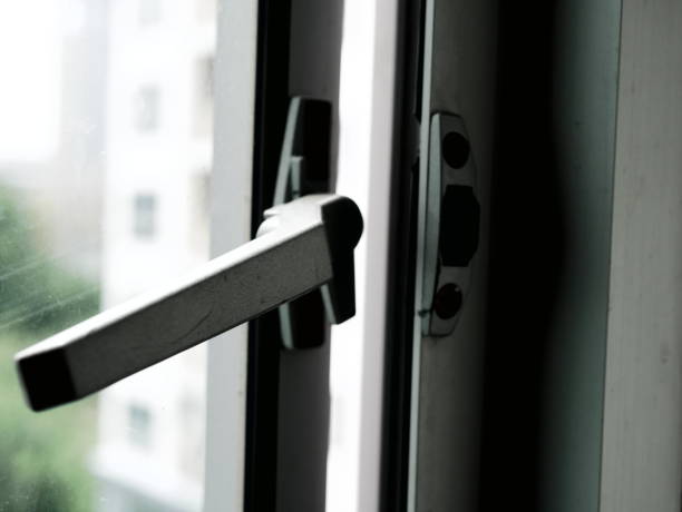 istock holding glass window latch lever 936972548
