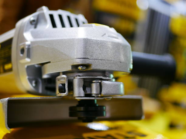 istock Electric wheel grinding on steel structure in factory 936973328