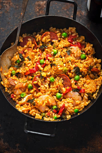 Chicken, king prawn & chorizo paella. Arborio rice cooked in white wine with cooked marinated chicken breast, king prawn and chorizo.