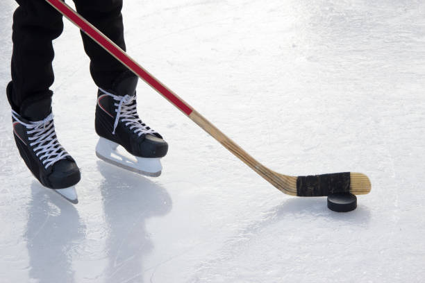 istock Hockey amatuer player on ice 936973826