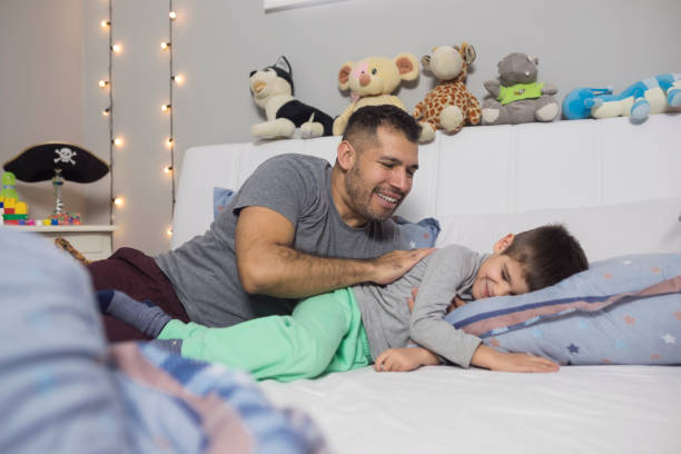 istock Father and son play together 936982600