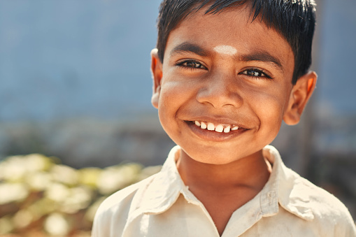 Cute Indian little boy happy portrait looking at the camera.
