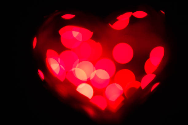 istock Red heart made of bokeh on black background 936986438