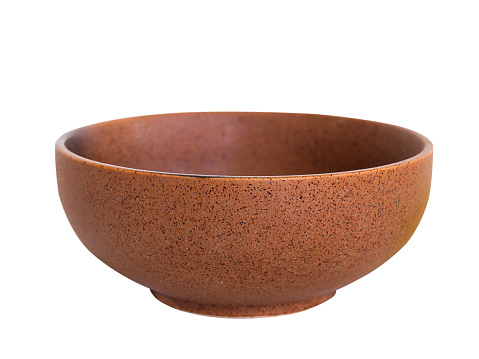 Brown ceramic bowl on white background.