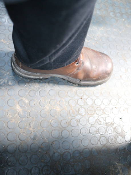 istock foot in a boot on the rubber floor 936990518