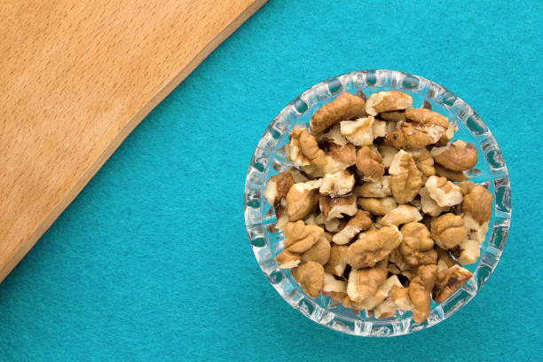 istock Menu background. Cook book. Recipe notebook with walnuts on a blue background 936991072