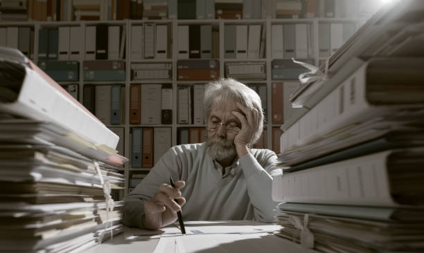 istock Senior businessman working in the office 936991164
