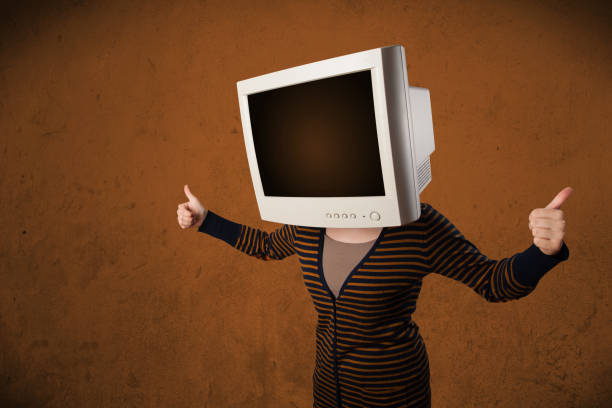 istock Girl with a monitor on her head and empty brown copyspace 936994570
