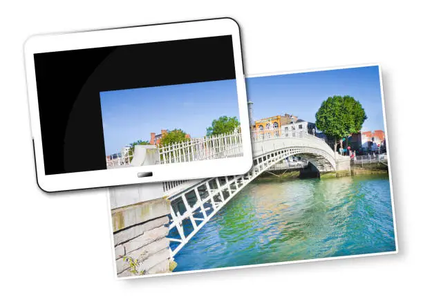 Photo of The most famous bridge in Dublin called -Half penny bridge- due to the toll charged for the passage - Concept image with 3D render of a digital tablet