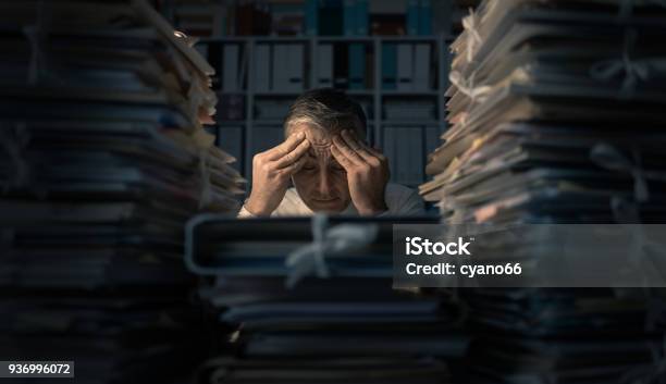 Desperate Businessman Working Late Stock Photo - Download Image Now - Working Late, Overworked, Paperwork