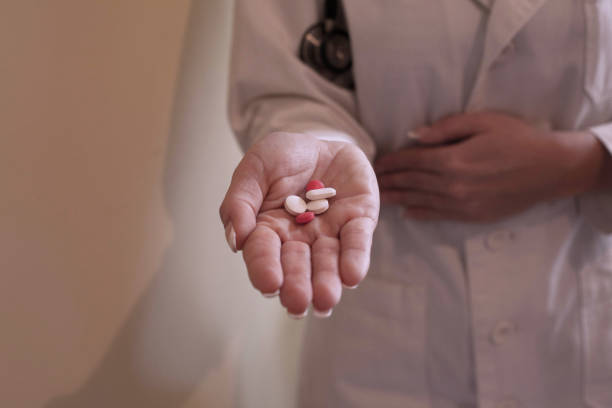 istock Doctor holding pills. 936999850