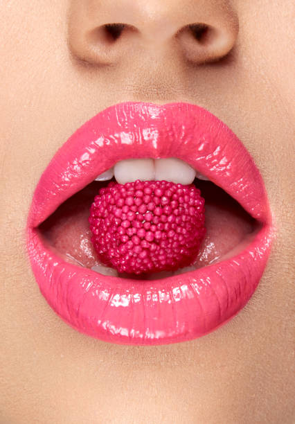 istock Pink Lips. Woman With Candy In Mouth. 937002922
