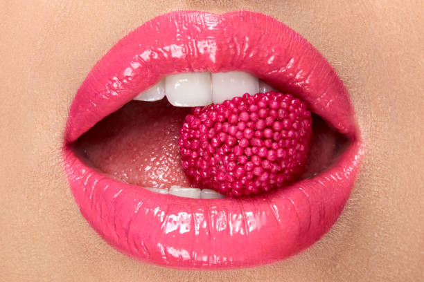 istock Pink Lips. Woman With Candy In Mouth. 937002978