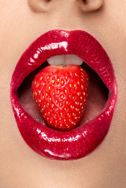 istock Lips. Woman With Red Lipstick And Strawberry 937003338
