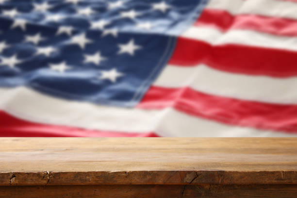 istock American flag background with empty table for american celebration. Presentation mockup. 937003482