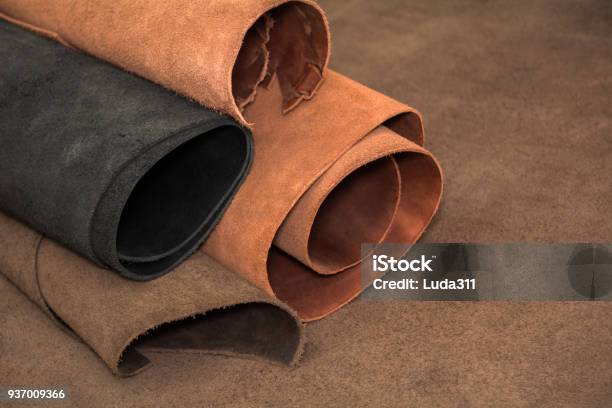 Rolls Of Natural Brown And Black Leather Materials For Leather Craft Stock Photo - Download Image Now