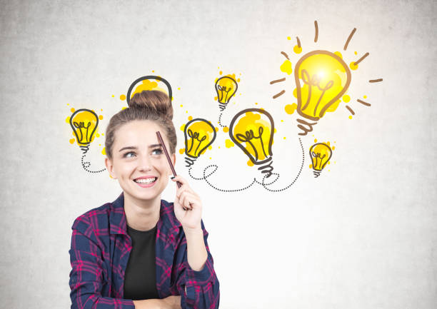 istock Smiling teen girl thinking, bright ideas 937009914