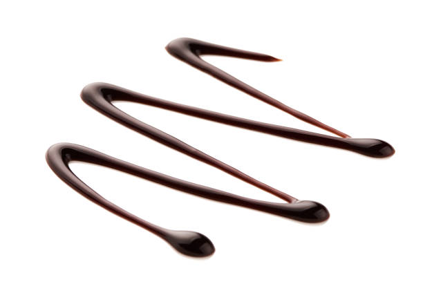 istock Chocolate sauce. Hot sweet liquid. Wave isolated on white background. 937010070