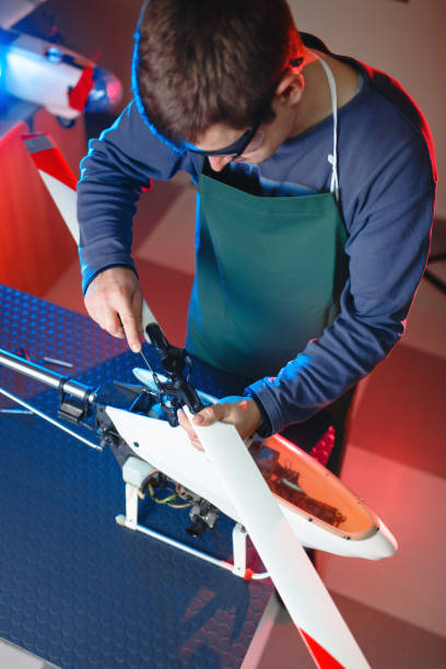 istock Young Male Engineer or Technician Repair Drone Details. 937017226