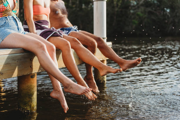 istock Friends relaxing on the pier 937018506