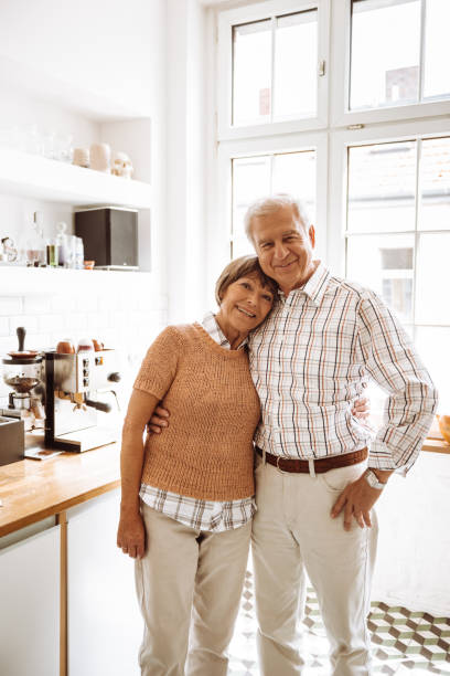 istock senior adult standing in the kitchen 937018756